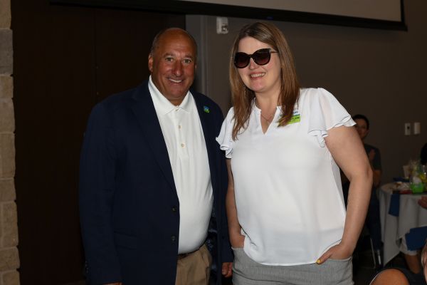 Marybeth standing with Michael Monteferrante, both smiling at the camera.